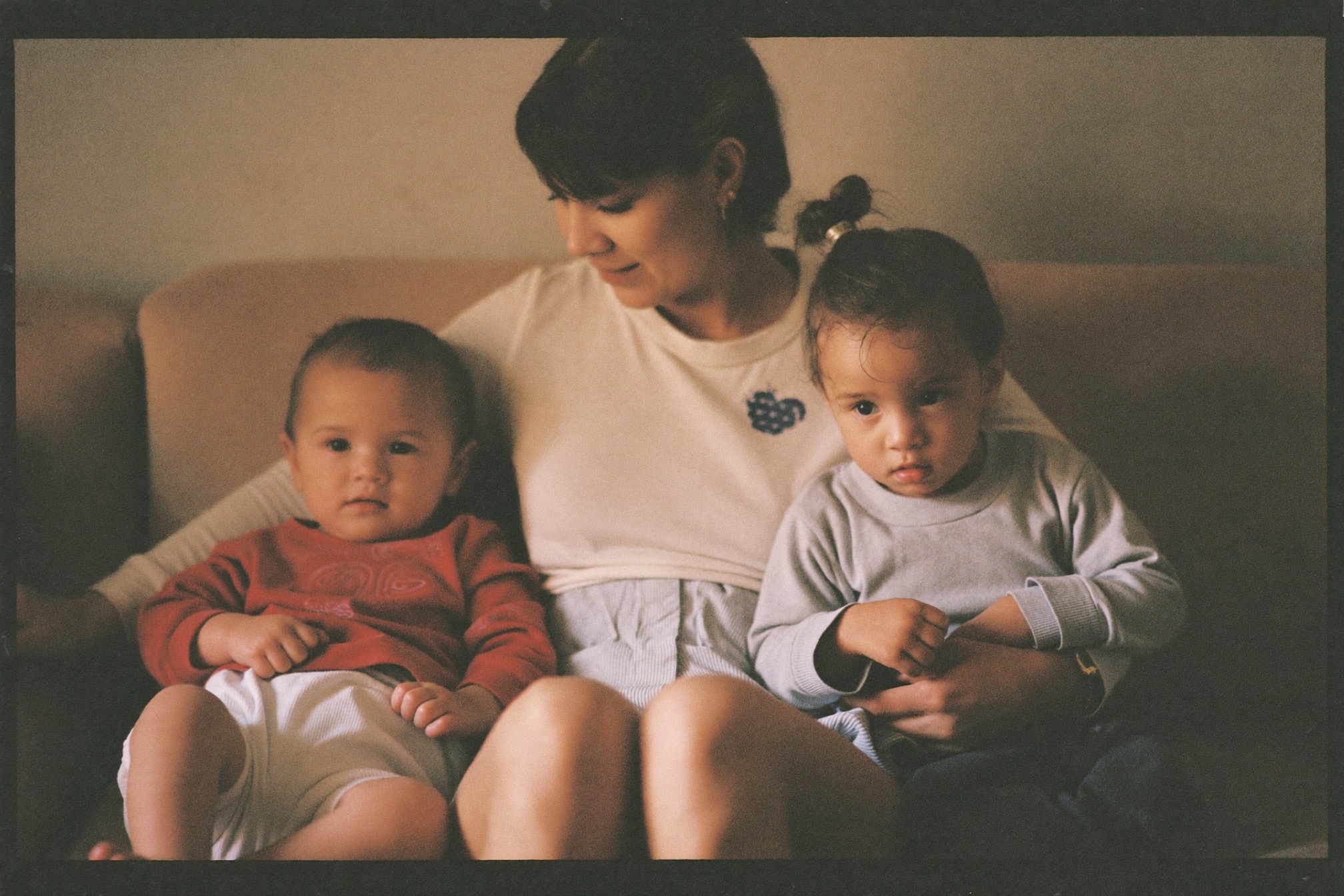 A woman at home with her two children